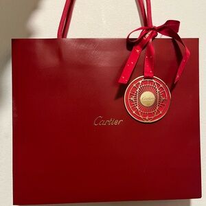 Original Cartier red shopping bag with a 2024 special holiday charm